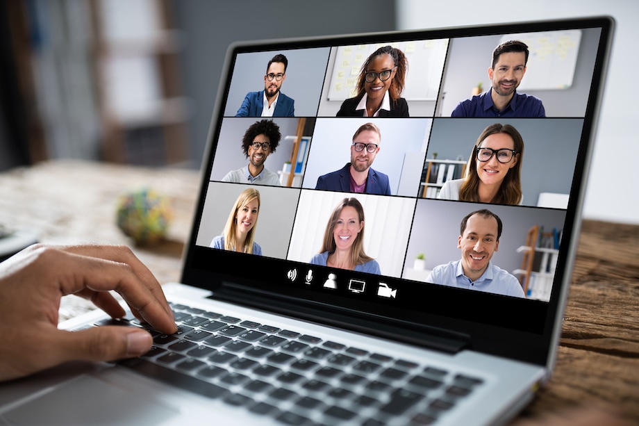 attending a webinar on a laptop