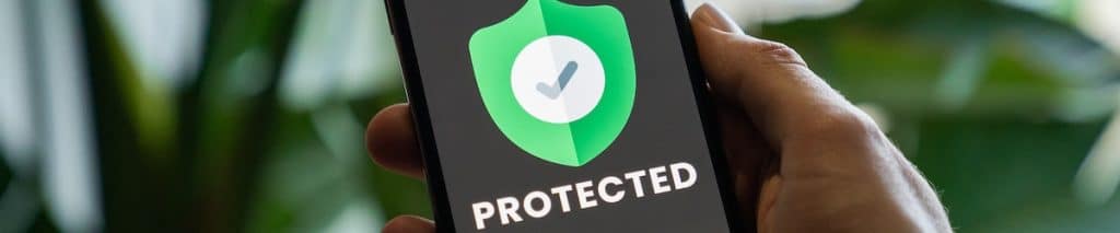 Protected, green shield icon with a check mark
